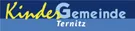 Ein blauer Banner mit dem Text 'Kindergemeinde Ternitz' in gelber und blauer Schrift. Das Wort 'Kindergemeinde' ist gelb und 'Ternitz' ist blau.