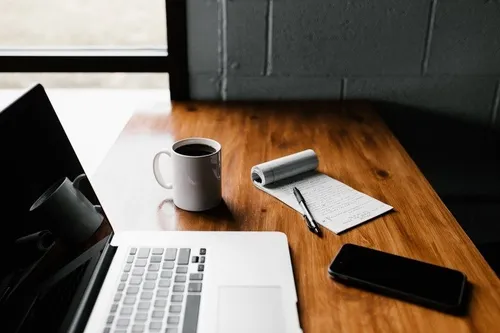 Cup, Furniture, Table, Text, Laptop, Pc, Phone, Tabletop, Mobile Phone, Computer Keyboard