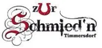 Das Logo von Schmied'n Timmersdorf zeigt ein stilisiertes 'S' mit kunstvollen Wirbeln, den Namen 'Schmied'n' in fetten schwarzen Buchstaben und 'Timmersdorf' darunter in einer kleineren Serifenschrift, alles auf weißem Hintergrund.