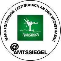 Das Logo für Leuschaach an der Weinstraße, mit einem grünen Baumsymbol und 'Leuschaach' in Weiß, eingeschlossen in einem Kreis mit 'Marktgemeinde' und 'Weinstraße' in Schwarz auf weißem Hintergrund.