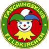 Ein rundes Logo mit einem lächelnden Joker in einem gelben Outfit und einem bunten Hut. Der Text 'Faschingsklub Feldkirchen' steht in fetten Buchstaben. Der Hintergrund ist eine Kombination aus roten, gelben und grünen Farben.