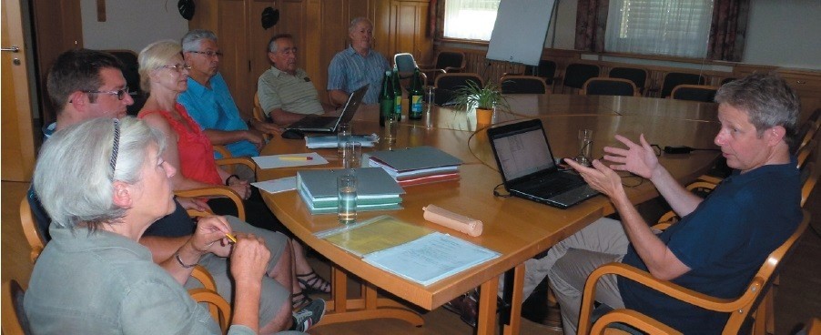 People, Person, Adult, Female, Woman, Table, Seminar, Male, Man, Chair
