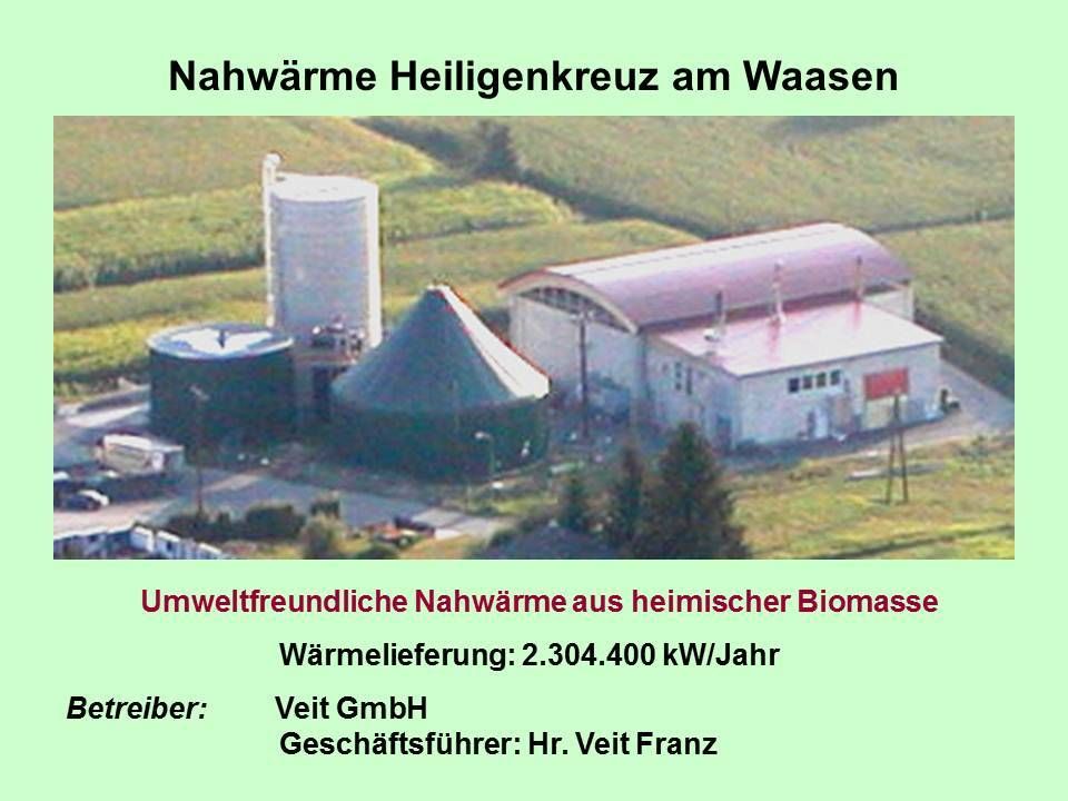Das Bild zeigt eine Anlage namens Nahwärme Heiligenkreuz am Waasen, die umweltfreundliche Heizung präsentiert. Die Anlage liefert 2.304.400 kW/Jahr. Betrieben von Veit GmbH, geleitet von Herrn Veit Franz.
