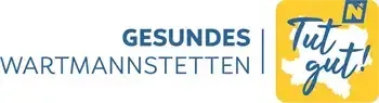 Auf einem weißen Hintergrund sind zwei Logos zu sehen. Links sind die Worte 'Gesundes Wartmannissetten' in Blau geschrieben. Rechts steht der Text 'Tut gut!' in Blau, mit einem weißen Umriss.