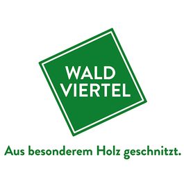 Logo des Wald Viertel, mit einem quadratischen Rahmen und grünem Text, der 'WALD VIERTEL' liest, über einem Slogan in deutscher Sprache.
