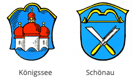 Zwei heraldische Schilde sind dargestellt. Der linke zeigt eine burgartige Struktur mit roten Kuppeln und ist mit 'Königssee' beschriftet. Der rechte zeigt ein gekreuztes Messer und einen Meißel mit einem gebogenen Bogen und ist mit 'Schönau' beschriftet.