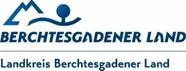 Das Logo für Berchtesgadener Land, mit einem stilisierten Berg und einer Person, darunter der Text 'Berchtesgadener Land' und 'Landkreis Berchtesgadener Land'.