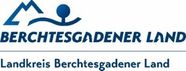 Das Logo für Berchtesgadener Land, mit einem stilisierten Berg und einer Person, darunter der Text 'Berchtesgadener Land' und 'Landkreis Berchtesgadener Land'.