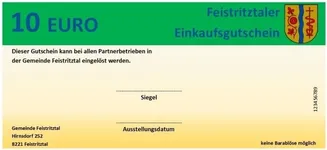 Ein 10-Euro-Gutschein der Gemeinde Feistritztal wird gezeigt. Er kann bei allen Partnerunternehmen innerhalb der Gemeinde eingelöst werden. Der Gutschein enthält ein Siegel, und der Name und die Adresse der Gemeinde sind aufgeführt. Die Gutscheinnummer lautet 123456789.