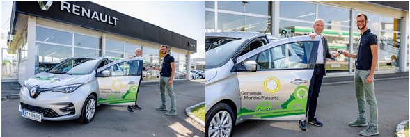Zwei Männer stehen vor einem Renault Elektroauto, einer hält die Tür offen. Das Gebäude hat ein Renault-Schild.