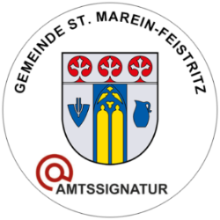 Ein kreisförmiges Emblem mit einem Wappen, das einen gelben und blauen Streifen, ein Kreuz und eine Vase zeigt. Oben steht 'Gemeinde St. Marein-Feistritz' und unten 'Amtsssigung'.