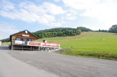 Outdoors, Nature, Scenery, Airport, Countryside, Shelter, Field, Housing, Road, Pasture
