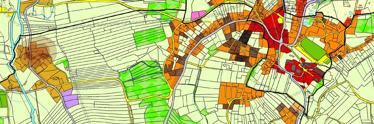 Eine farbenfrohe Karte, die verschiedene Landnutzungen zeigt, einschließlich Wohn-, Gewerbe- und landwirtschaftlichen Flächen, wobei verschiedene Farben verschiedene Arten der Landnutzung darstellen.