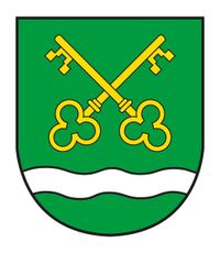Ein grüner Schild mit einer weißen Wellenlinie am unteren Rand und zwei gelben Schlüsseln, die sich darüber kreuzen.