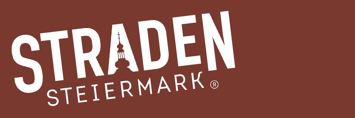 Das Logo für Traden Tiermarkt, mit einem braunen Hintergrund, weißem Text und einem Turmsymbol über dem Wort 'Traden'.