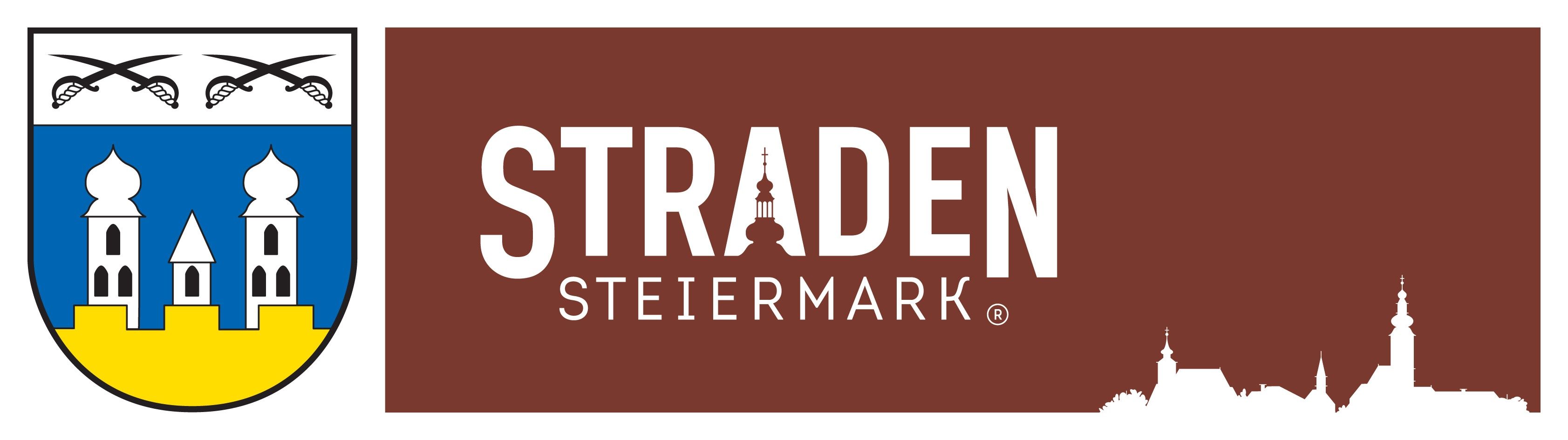 Das TRADE STEIERMARK Logo zeigt einen stilisierten Kirchturm mit einem Kreuz, vor einem braunen Hintergrund mit weißem Text.