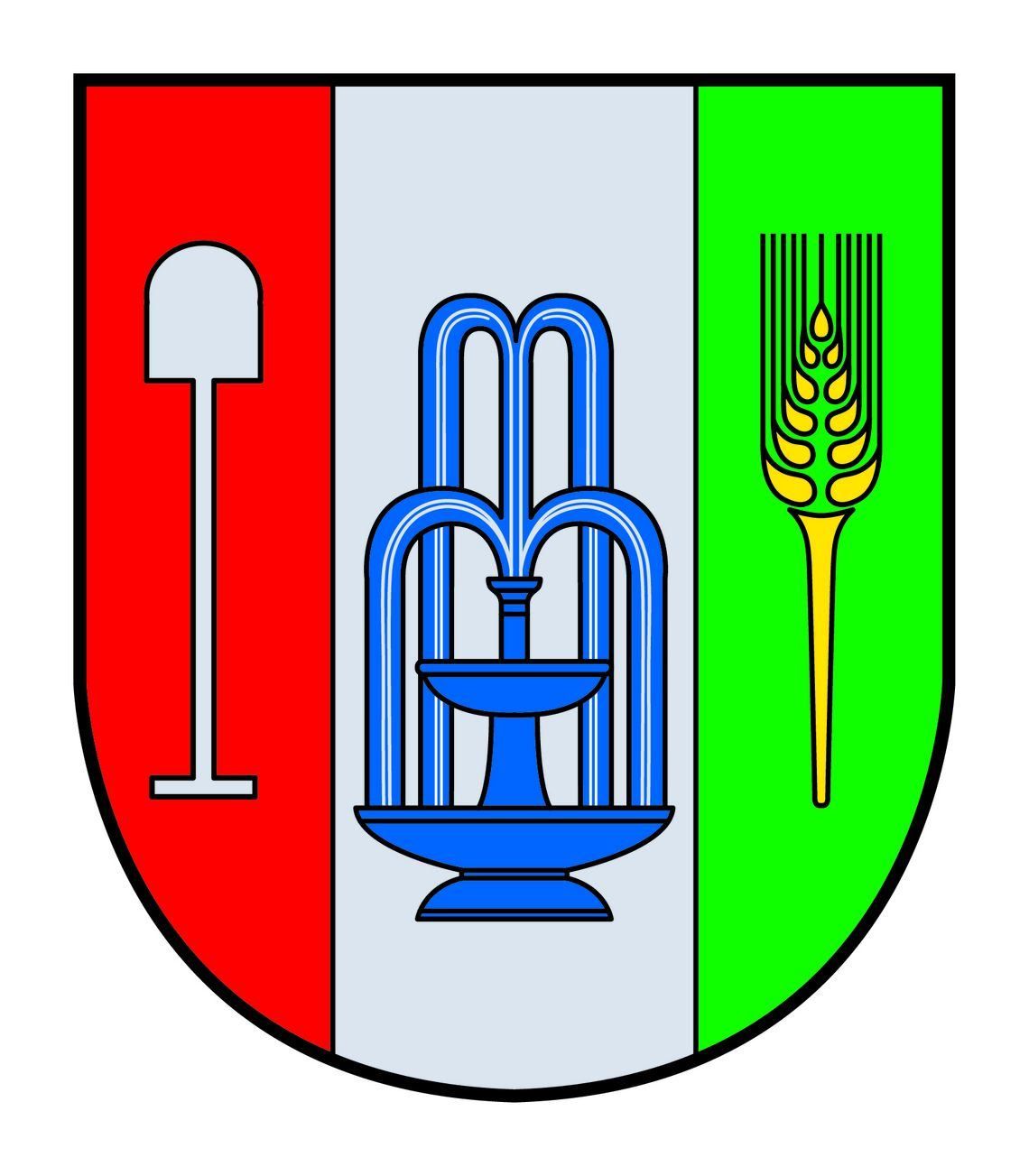 Das Wappen zeigt einen roten, weißen und grünen Schild. Die linke Seite zeigt eine weiße Schaufel, die Mitte einen blauen Brunnen und die rechte Seite eine gelbe Weizengarbe auf grünem Hintergrund.