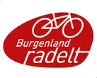 Das Burgenland radelt Logo zeigt ein Fahrrad-Symbol auf rotem ovalem Hintergrund mit weißem Text 'Burgenland radelt'.
