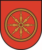 Ein roter Schild mit einem goldenen Rad in der Mitte. Das Rad hat acht Speichen.