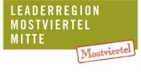 Ein grüner Banner mit weißem Text, der 'Leader Region Mostviertel Mitte' lautet. Unten befindet sich ein roter und weißer Aufkleber mit dem Wort 'Mostviertel'.