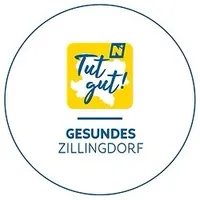 Das Logo für Gesundes Zillingdorf, mit einem gelben Kreis, einer stilisierten Karte von Zillingdorf und dem Text 'Tut gut!' in Blau.