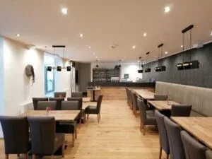 Indoors, Restaurant, Cafeteria, Dining Table, Furniture, Table, Cafe, Dining Room, Interior Design, Lounge