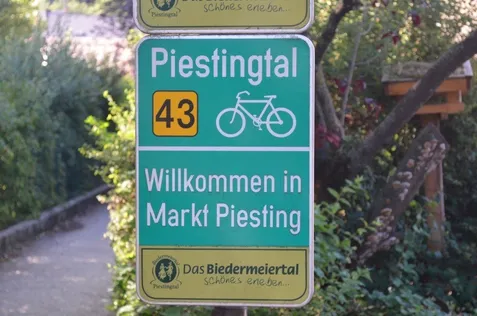 Sign, Symbol, Road Sign, Bicycle, Vehicle, Garden, Outdoors, Machine, Wheel, Vegetation