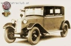 Ein altes Foto zeigt ein Oldtimer mit schwarzem Dach und Seitenfenstern. Es hat ein goldenes Emblem auf der Motorhaube.