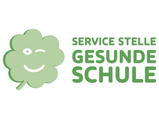Ein grünes Kleeblatt mit einem lächelnden Gesicht und dem Text 'SERVICE STE GESUN SCHUL' in grüner Schrift.