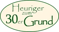 Ein Logo für Heuriger zum 30er Grund, das einen grünen Oval mit weißem Text auf schwarzem Hintergrund zeigt.