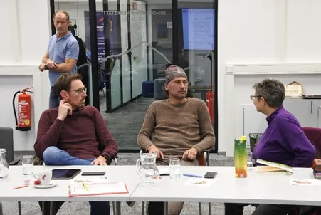 Indoors, Restaurant, Adult, Male, Man, Person, People, Table, Face, Conversation