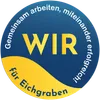 Ein kreisförmiges Logo mit den Worten 'Gemeinsam arbeiten, füreinander' und einem gelben 'WIR' in der Mitte auf blauem und gelbem Hintergrund.