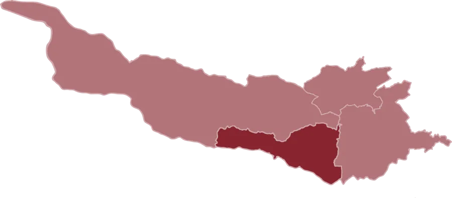 Karte mit zwei verschiedenen Regionen, einem größeren rosa Bereich und einem kleineren kastanienbraunen Bereich darin, vor schwarzem Hintergrund.