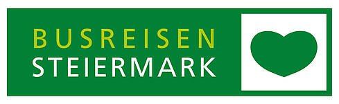 Grünes Schild mit den Worten Busreisen Steiermark und einem grünen Herzsymbol.
