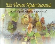 Ein Buchcover mit einer Nahaufnahme von Weinreben mit reifen Trauben und grünen Blättern. Der Titel lautet 'Ein Viertel Niederösterreich' und 'Streifzüge durch das Weinviertel'. Der Name des Autors, Dieter Groh, ist unten angegeben.