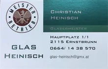 Ein Visitenkarte mit einem Logo, das einen Löwen und den Text 'Meisterbetrieb Christian Heinisch Glasermeister' zeigt. Die Karte enthält auch die Adresse 'Hauptplatz 1/1 2115 Ernstbrunn', Telefonnummer '0664/ 14 38 570' und E-Mail 'glas-heinsch@gmx.at'.