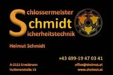 Ein schwarzer Hintergrund mit einem gelben Logo, das 'S chmidt' in fetten Buchstaben sagt. Unter dem Logo steht der Text 'Helmut Schmidt' in weiß. Es gibt auch eine Telefonnummer '+43 699-19 47 03 41' und eine E-Mail-Adresse 'office@helmut.at'. Die Adresse ist 'A-2113 Errobrunn Hutterstrase 15'.