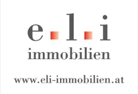 Das Bild zeigt das Logo von 'e1i immobilien' mit einer Website-Adresse 'www.eli-immobilien.at'. Das Logo besteht aus dem Firmennamen in fetten, großgeschriebenen Buchstaben mit einem stilisierten 'e' und 'i', getrennt durch eine '1'. Die Website ist in Kleinbuchstaben unter dem Logo angegeben.