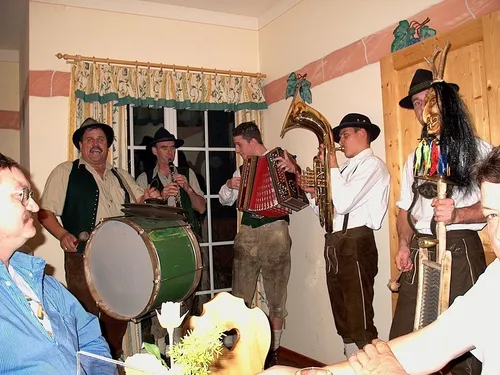 Person, Adult, Male, Man, Group Performance, Music Band, Musical Instrument, Face, Hat, Pants
